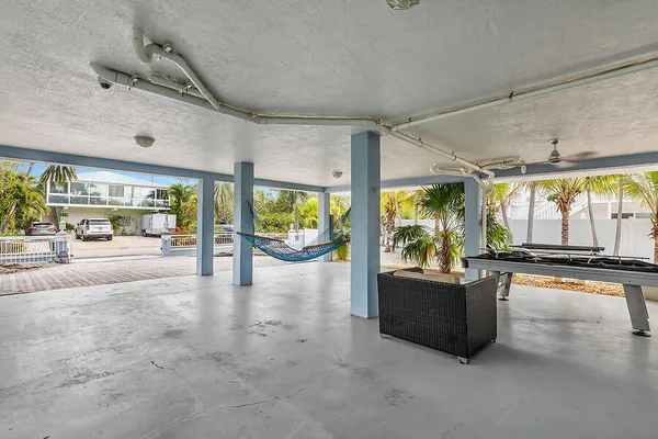a view of a livingroom with furniture water view and front door