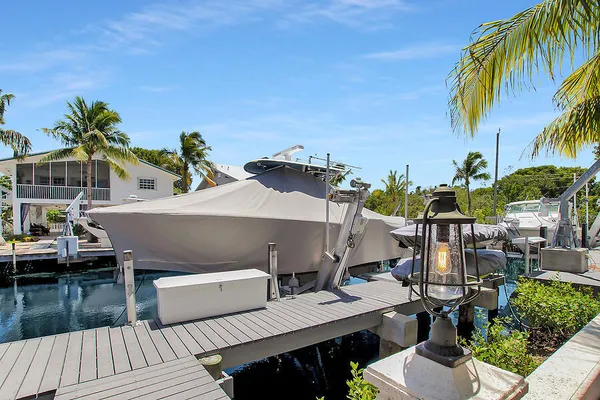 a view of a house with pool and sitting area