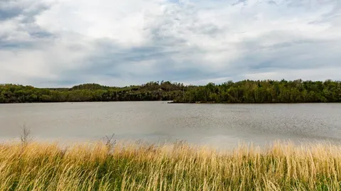 a view of lake with mountain in background