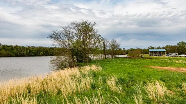 a view of lake with houses in the back