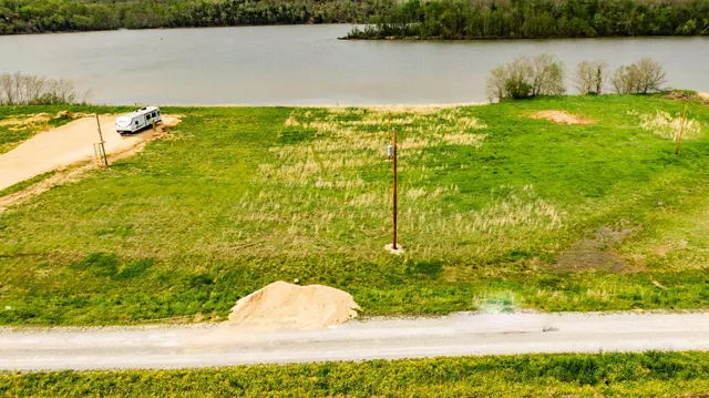 a view of a lake with a yard