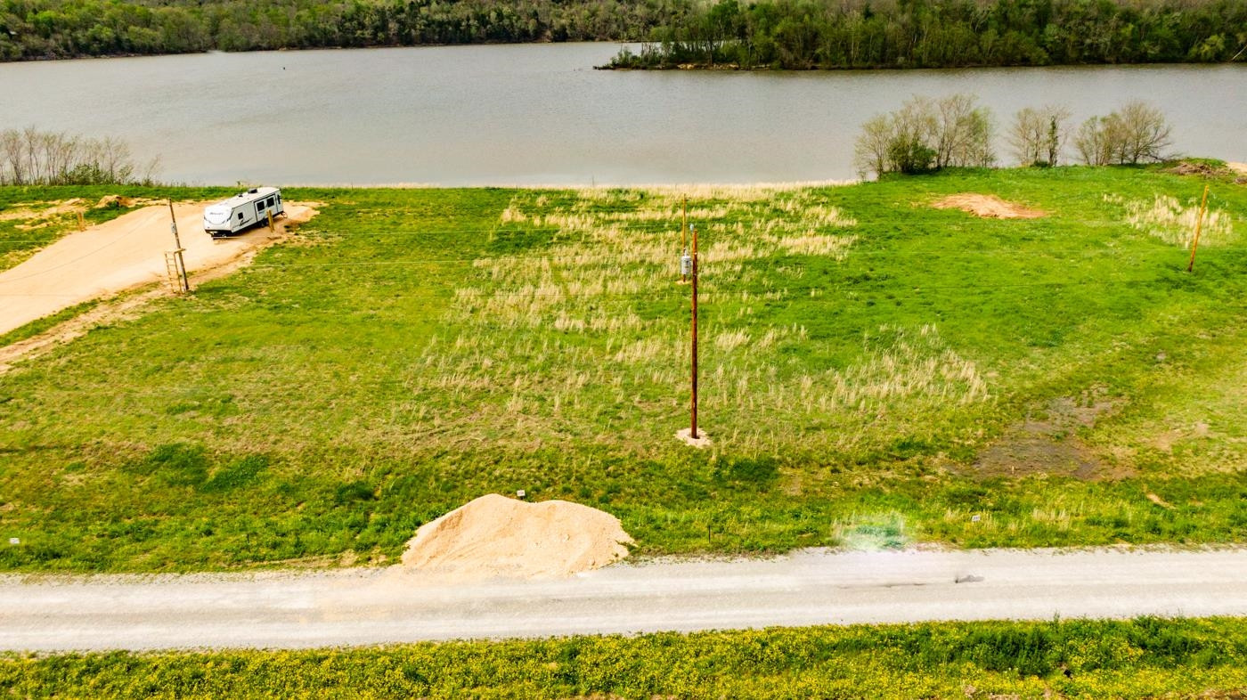 1823 Hardin Btm Road Clifton, TN 38425 - Photo 6 of 14 a view of a lake with a yard