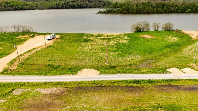 a view of a lake with a yard