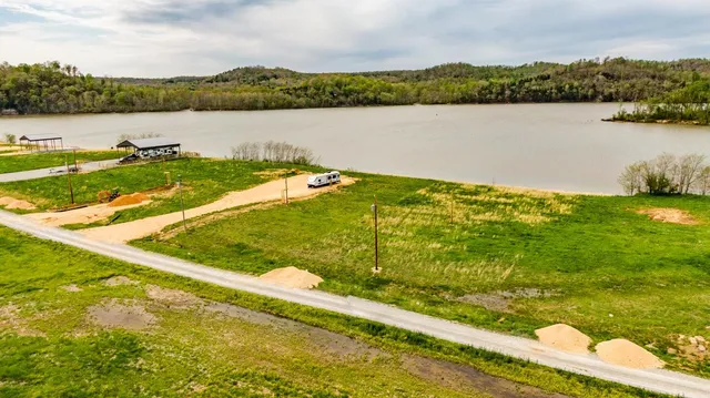 a view of a lake with houses in the back