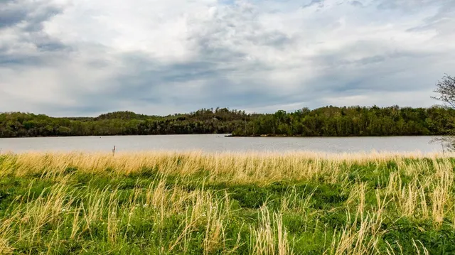 a view of lake with mountain in background