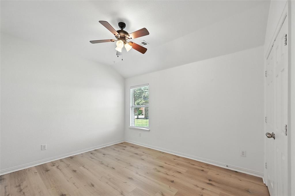 4312 Ridgewood Road Melissa, TX 75454 - Photo 11 of 40 an empty room with windows and fan