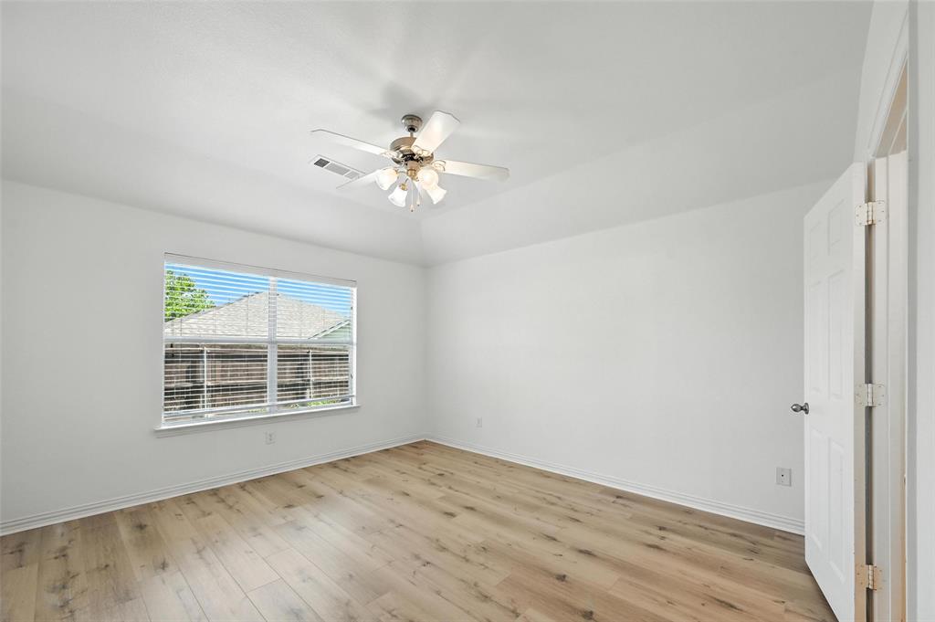 4312 Ridgewood Road Melissa, TX 75454 - Photo 23 of 40 an empty room with wooden floor and windows