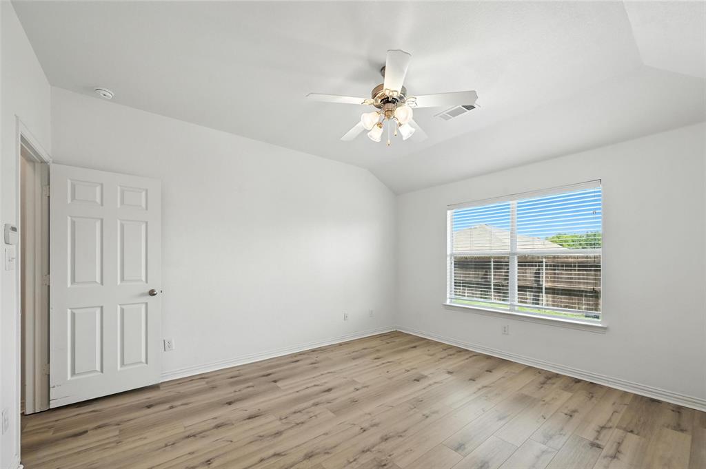 4312 Ridgewood Road Melissa, TX 75454 - Photo 25 of 40 a view of empty room with wooden floor and fan