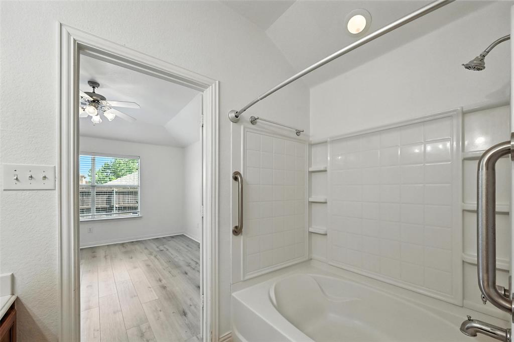 4312 Ridgewood Road Melissa, TX 75454 - Photo 28 of 40 a bathroom with a tub and shower
