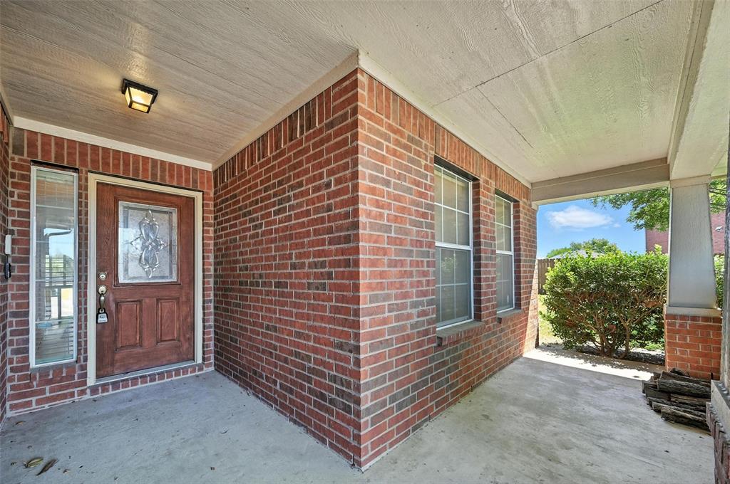 4312 Ridgewood Road Melissa, TX 75454 - Photo 31 of 40 a view of a porch with furniture and floor to ceiling window