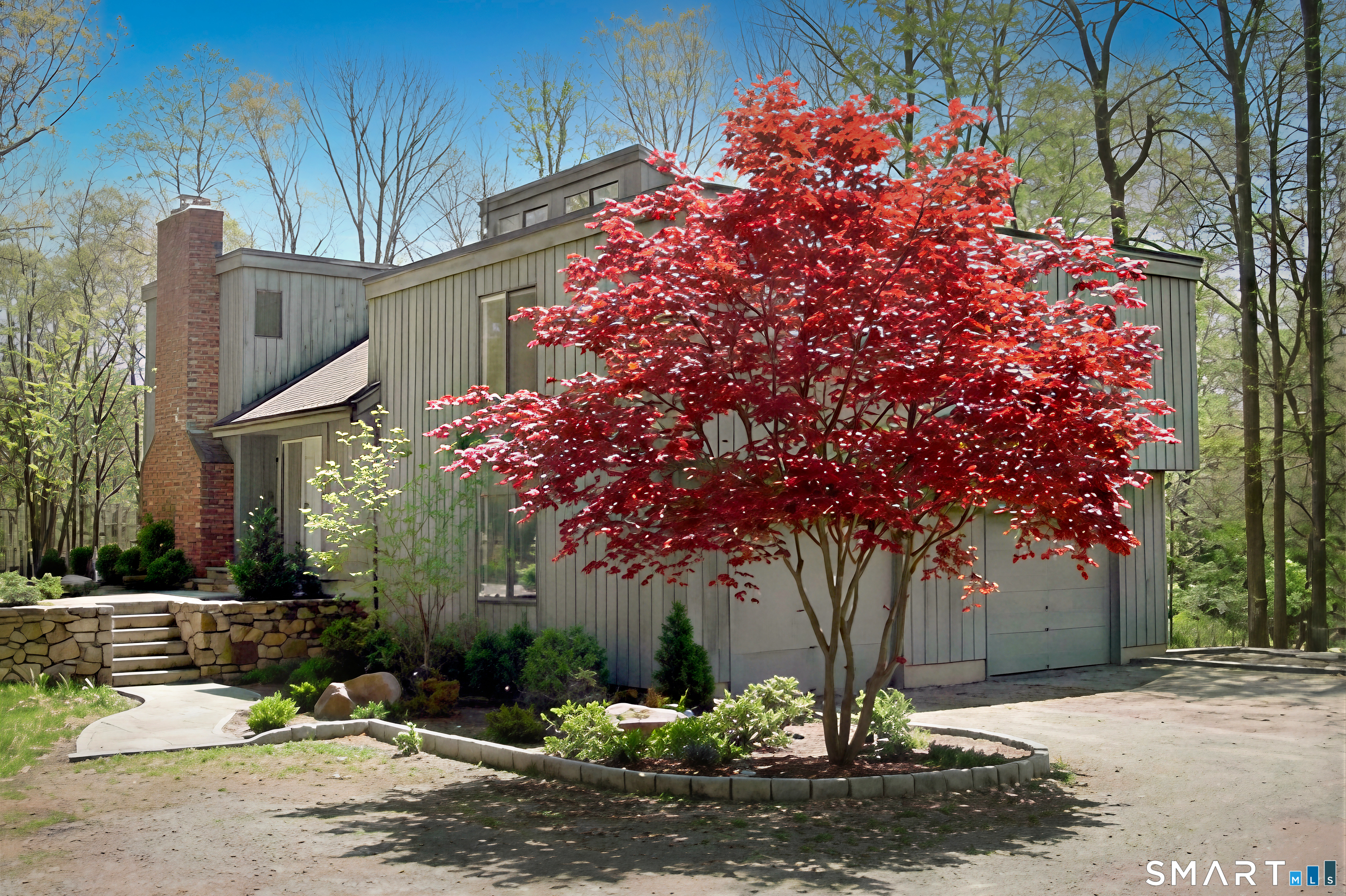 216 Silver Spring Road Wilton, CT 06897 - Photo 2 of 33 a front view of a house with a yard