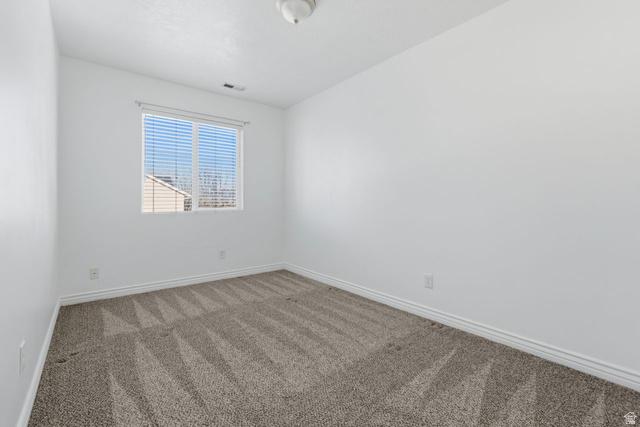 977 East 100 South Payson, UT 84651 - Photo 13 of 19 Empty room with carpet and baseboards