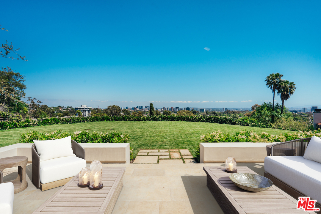 375 Fordyce Road Los Angeles, CA 90049 - Photo 19 of 26 a view of a terrace with couches and city view
