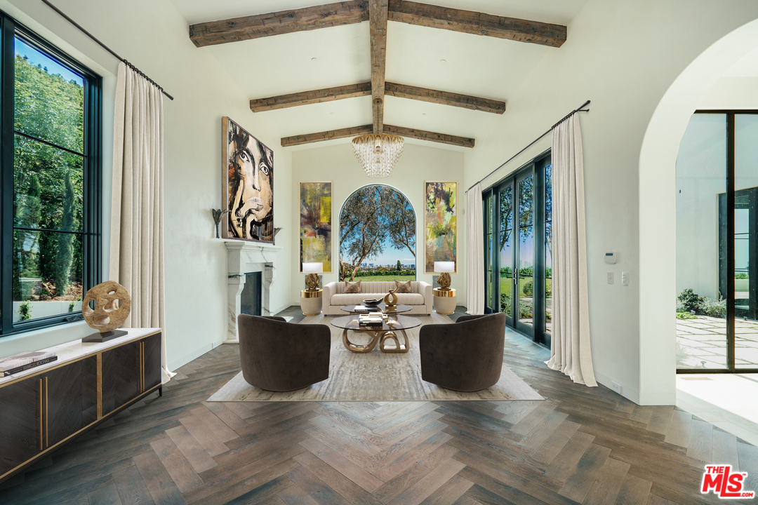 375 Fordyce Road Los Angeles, CA 90049 - Photo 4 of 26 a living room with fireplace furniture and a large window