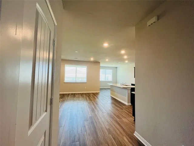 a view of kitchen with wooden floor