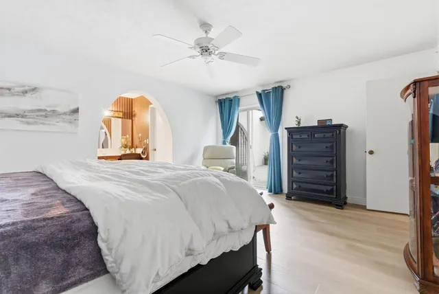 a view of backyard with swimming pool and outdoor seating