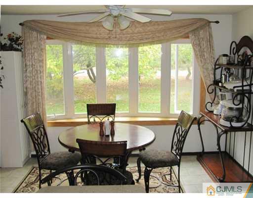 201 Raymond Road Princeton, NJ 08540 - Photo 5 of 10 a view of a dining room with furniture window and outside view