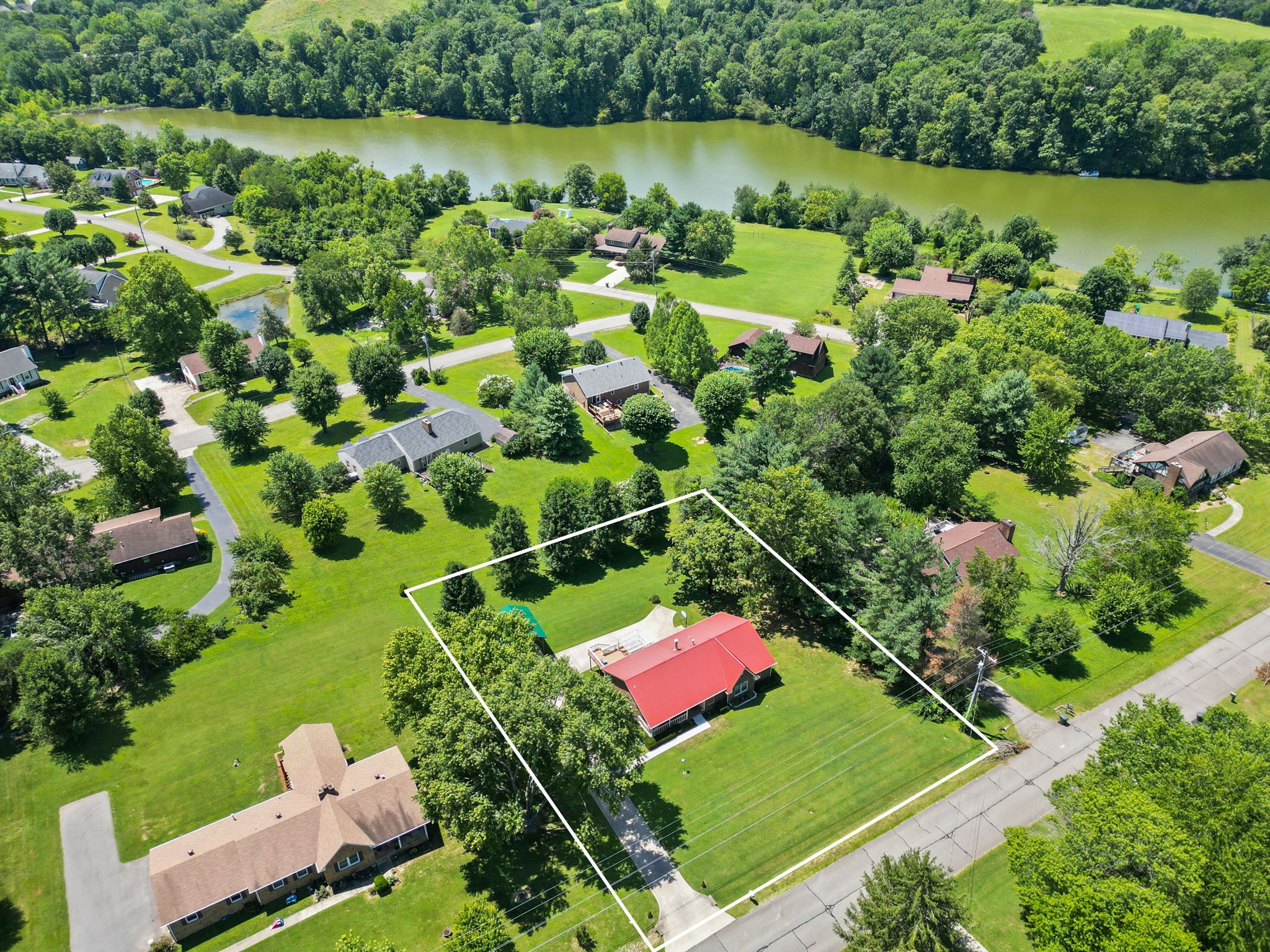666 Lakeside Drive Springfield, TN 37172 - Photo 2 of 67 an aerial view of a house with a garden and lake view