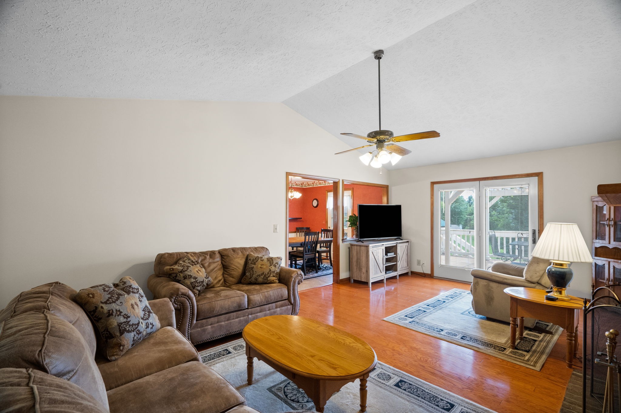 666 Lakeside Drive Springfield, TN 37172 - Photo 21 of 67 a living room with furniture a flat screen tv and a floor to ceiling window