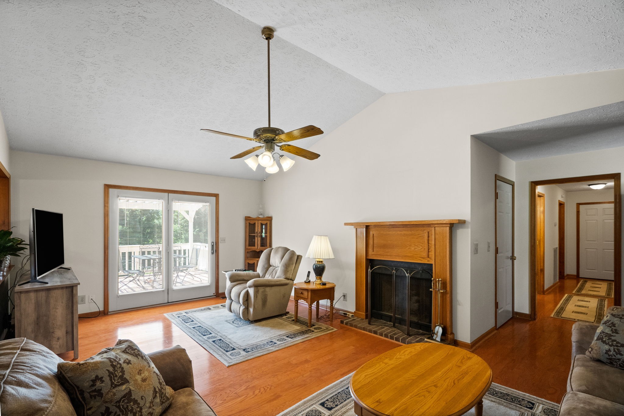 666 Lakeside Drive Springfield, TN 37172 - Photo 22 of 67 a living room with furniture a fireplace and a flat screen tv