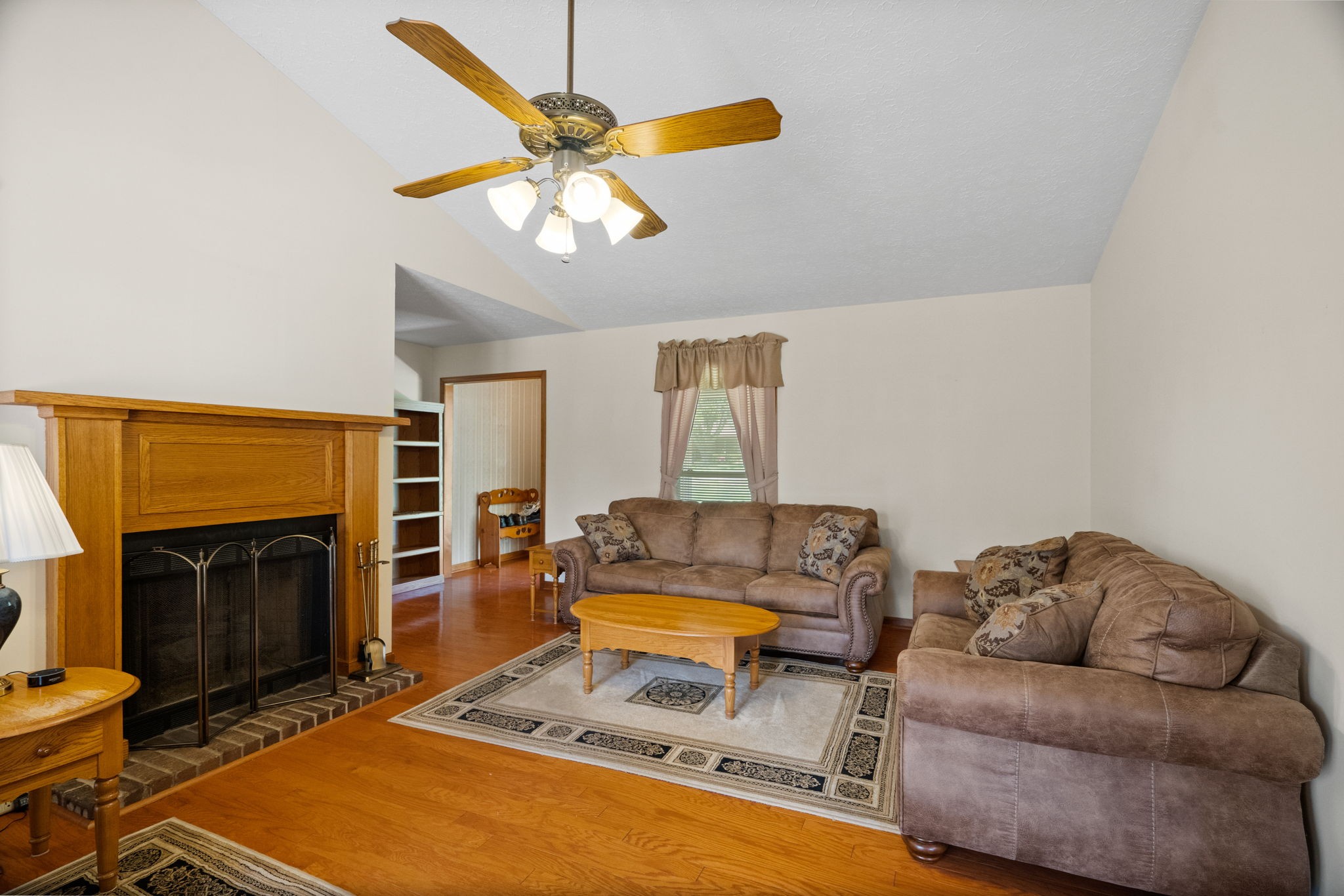 666 Lakeside Drive Springfield, TN 37172 - Photo 25 of 67 a living room with furniture a flat screen tv and a fireplace