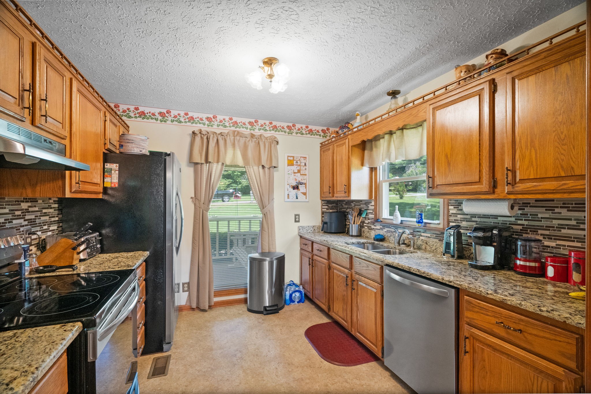 666 Lakeside Drive Springfield, TN 37172 - Photo 28 of 67 a kitchen with stainless steel appliances granite countertop sink stove and refrigerator