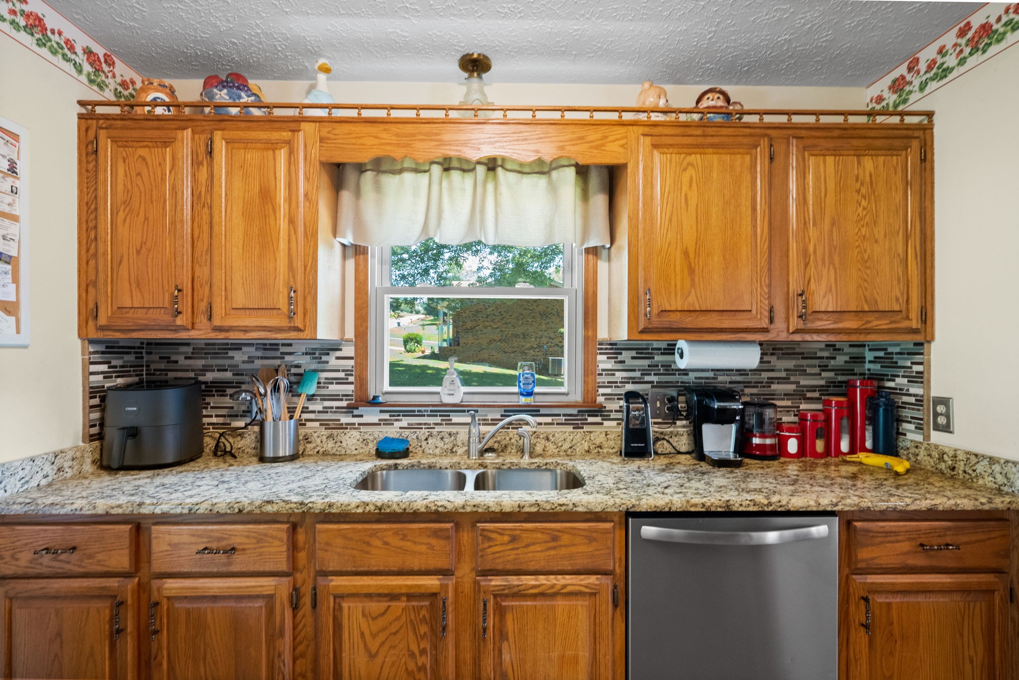 666 Lakeside Drive Springfield, TN 37172 - Photo 30 of 67 a kitchen with stainless steel appliances granite countertop a sink a counter space and cabinets