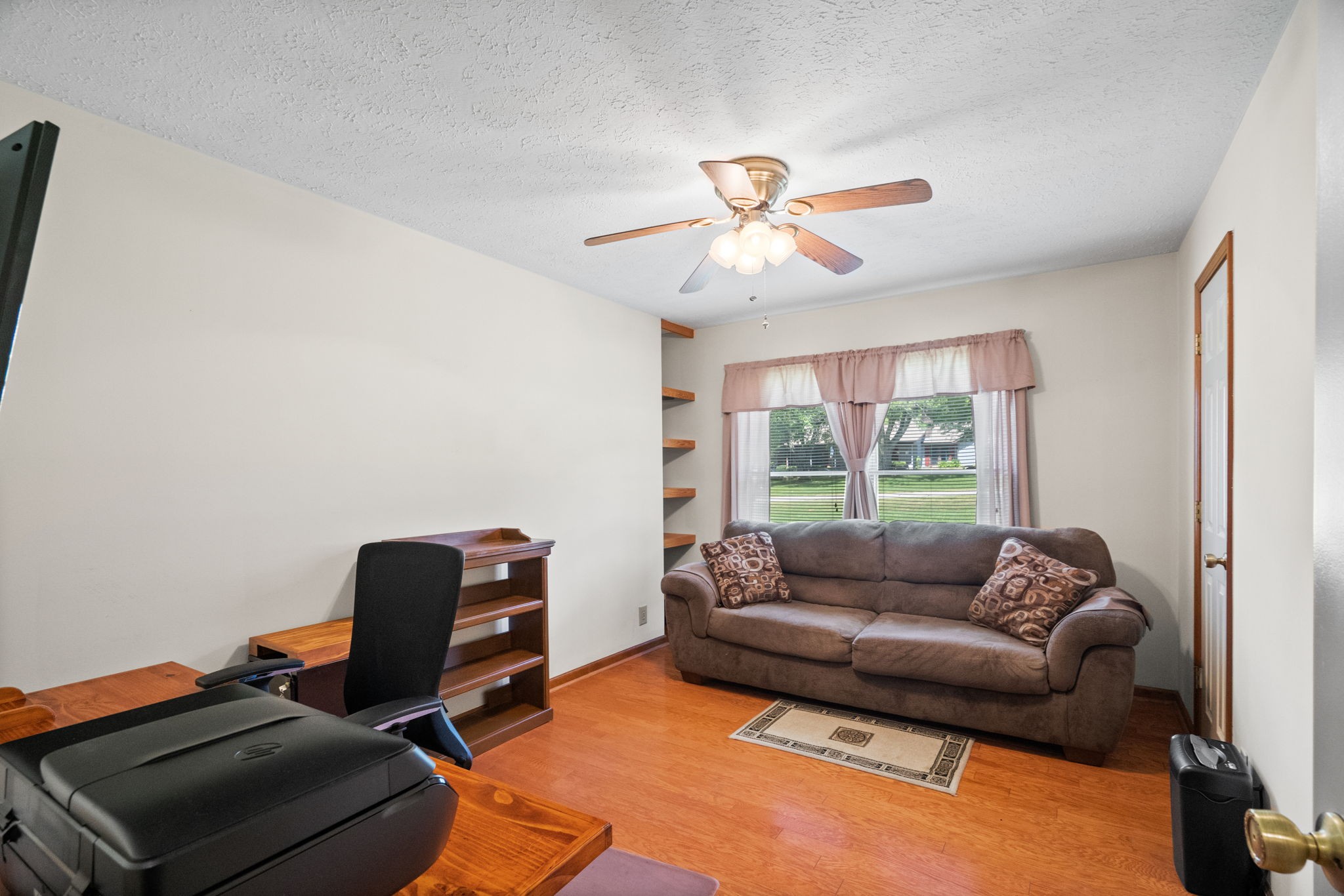 666 Lakeside Drive Springfield, TN 37172 - Photo 35 of 67 a living room with furniture a ceiling fan and a window