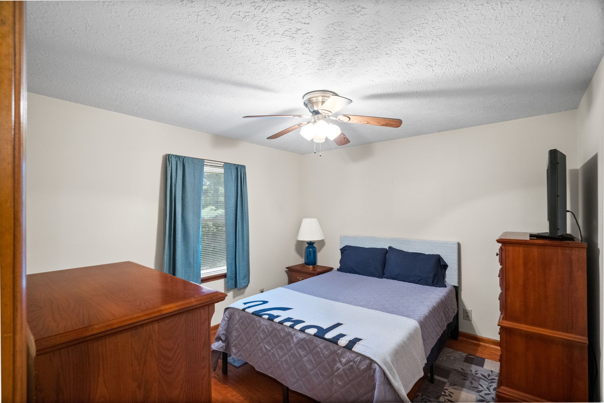 666 Lakeside Drive Springfield, TN 37172 - Photo 36 of 67 a bedroom with a bed and a chandelier