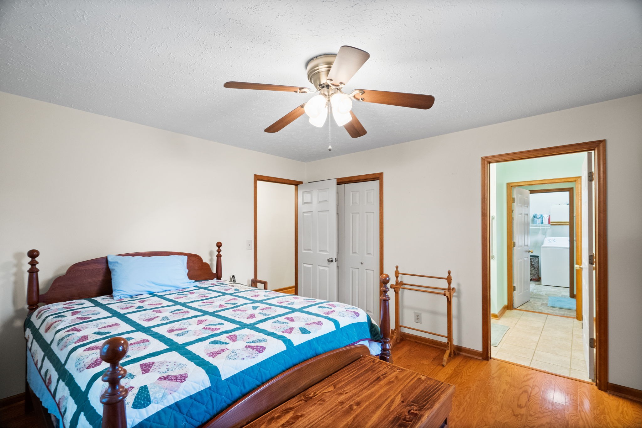 666 Lakeside Drive Springfield, TN 37172 - Photo 39 of 67 a bedroom with a bed and a chandelier