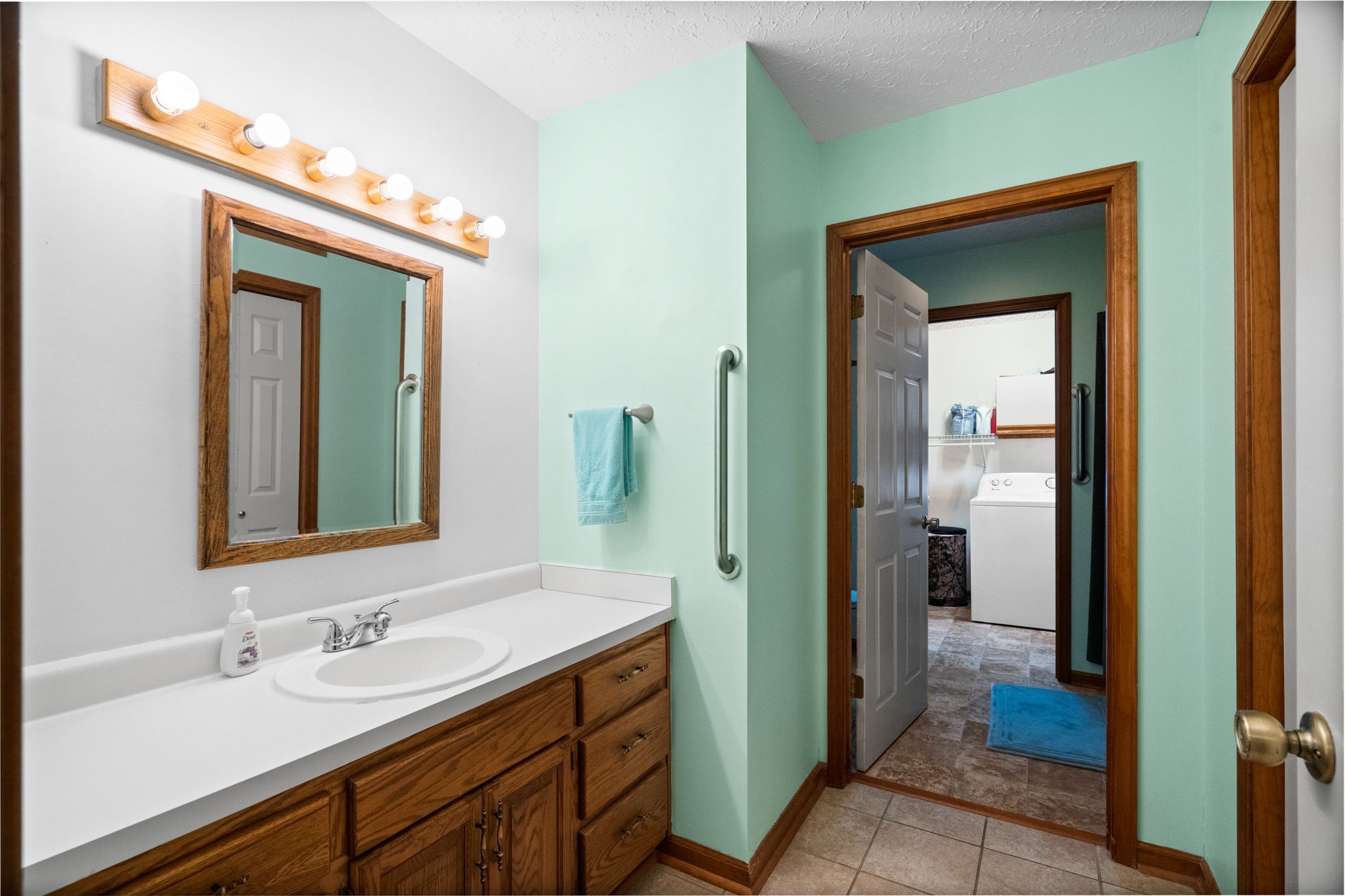 666 Lakeside Drive Springfield, TN 37172 - Photo 40 of 67 a bathroom with a sink a mirror and a shower