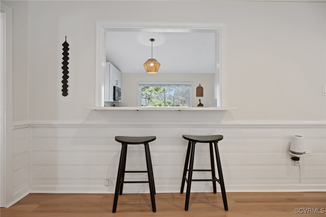 12646 Old Ridge Road Beaverdam, VA 23015 - Photo 8 of 48 Bar featuring hanging light fixtures and hardwood