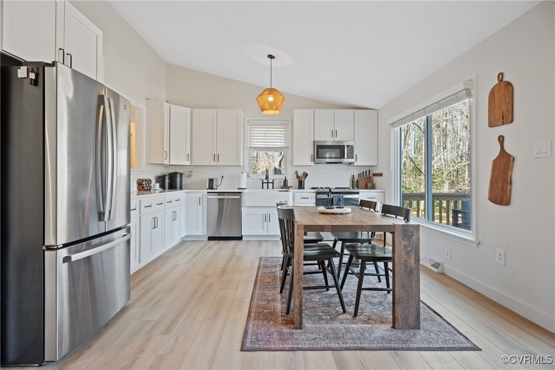 12646 Old Ridge Road Beaverdam, VA 23015 - Photo 9 of 48 Kitchen with white cabinetry, appliances with stai