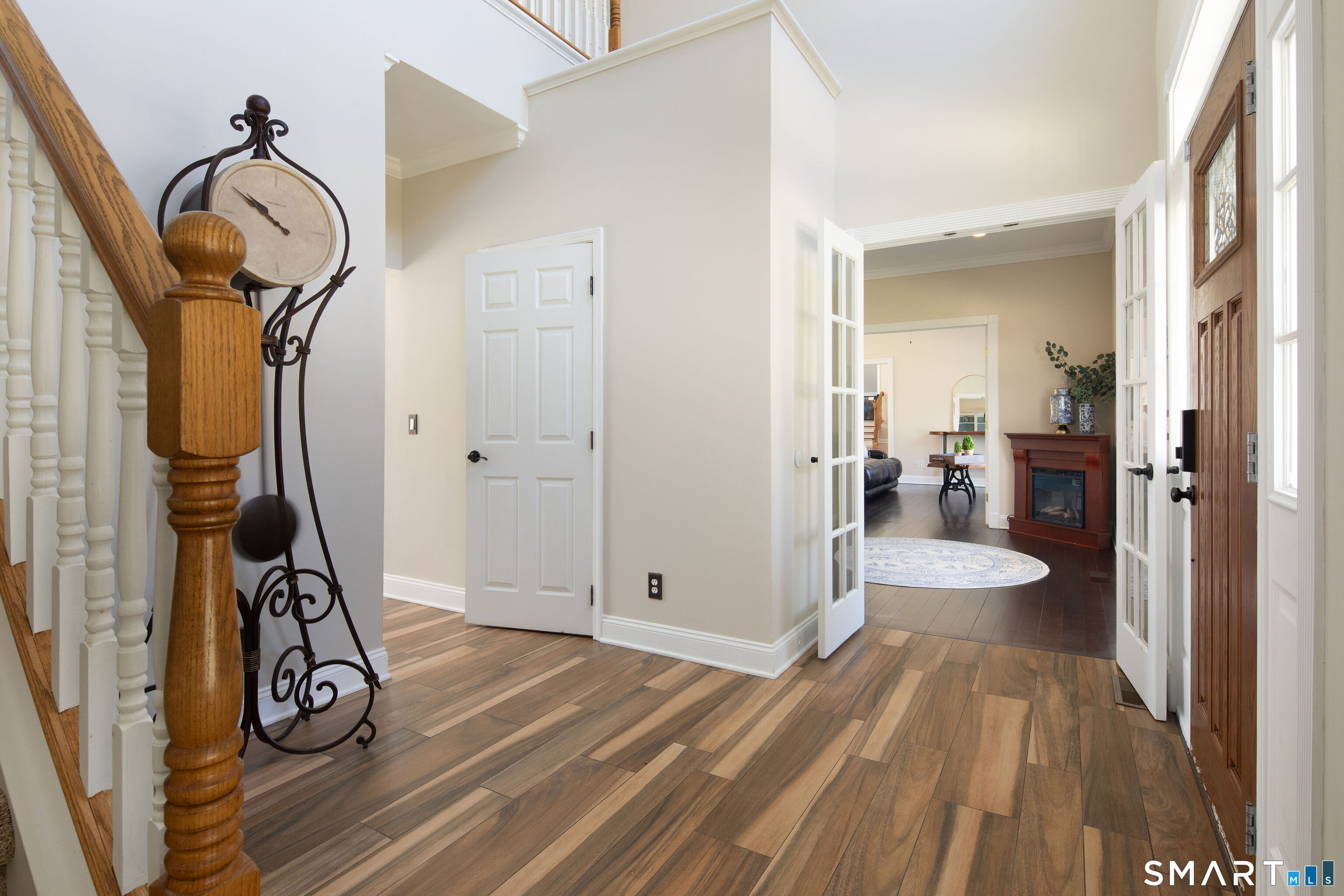 27 Smoke Ridge Drive Sherman, CT 06784 - Photo 6 of 40 Foyer leads to sitting room, dining room and main floor primary suite.