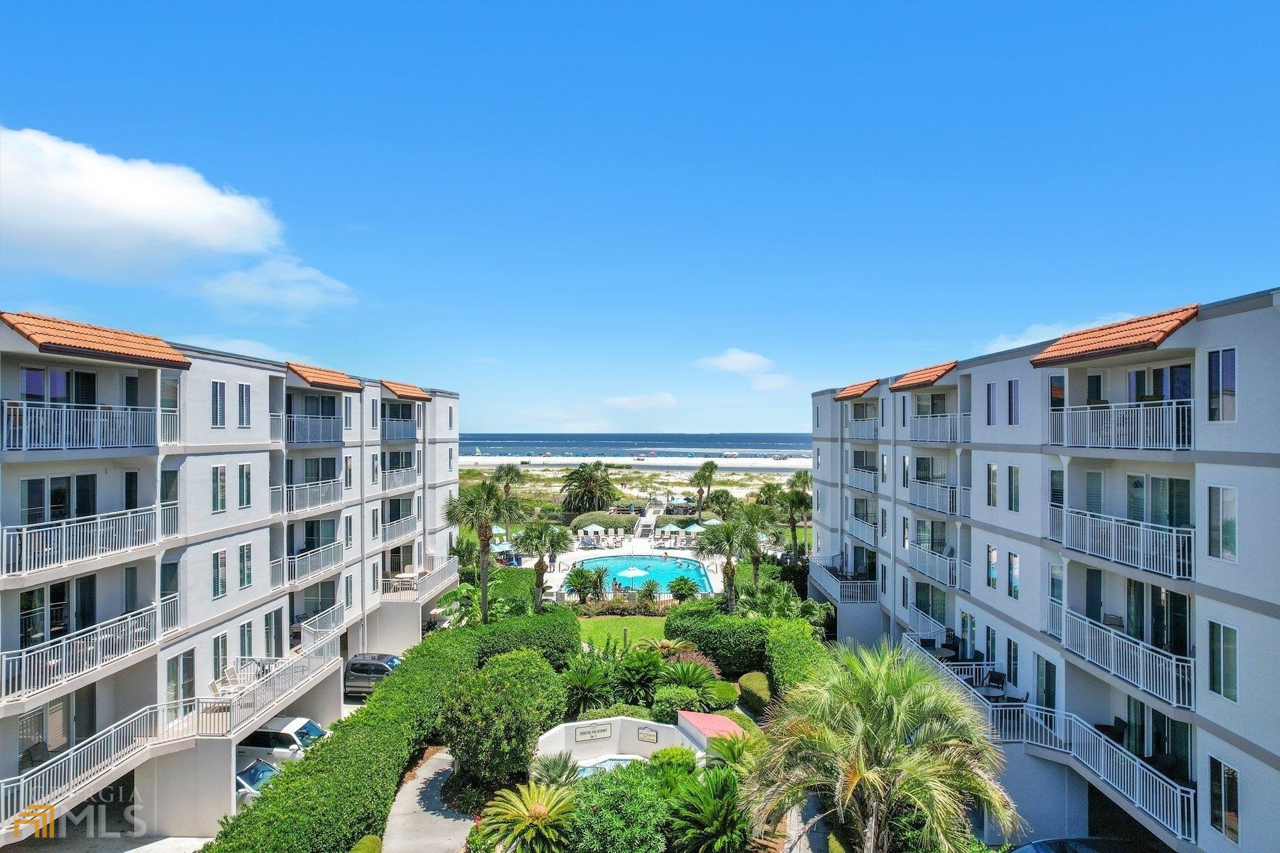 1440 Ocean Boulevard, Unit 306 St. Simons, GA 31522 - Photo 1 of 1 a view of building with yard