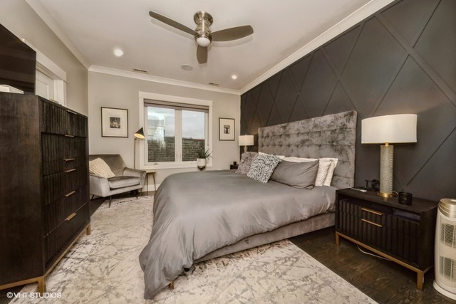 4730 South Champlain Avenue, Unit 3 Chicago, IL 60615 - Photo 13 of 16 a bedroom with a bed and wooden floor