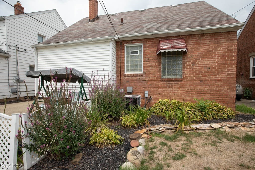 12822 Grannis Road Cleveland, OH 44125 - Photo 36 of 44 Back of house with cooling unit