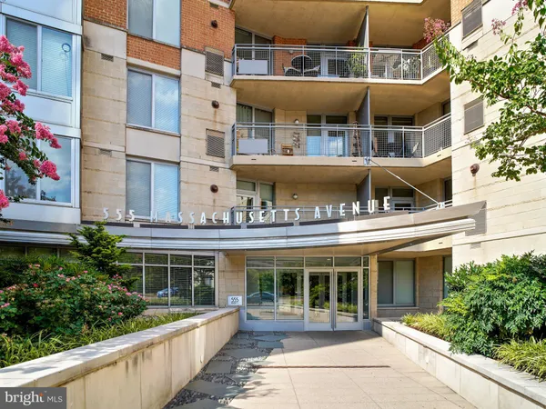 front view of a building with a garden