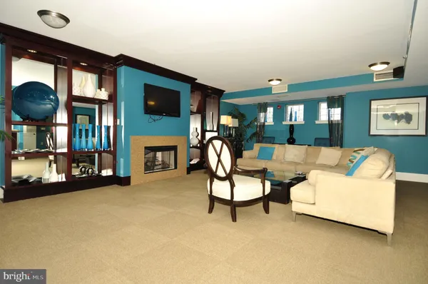 a view of livingroom with furniture and an empty room