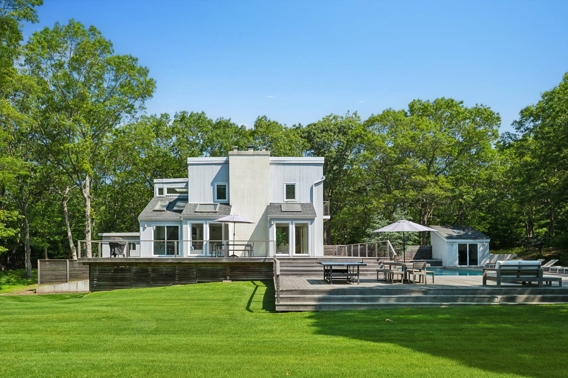 2 Jodys Path East Hampton, NY 11937 - Photo 13 of 43 a front view of a house with garden