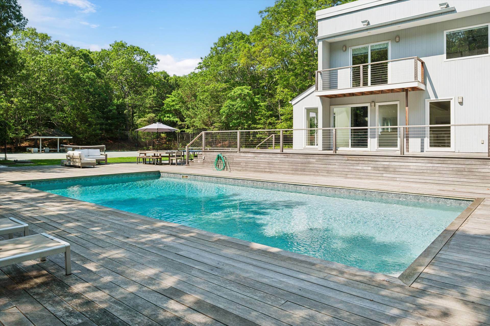 2 Jodys Path East Hampton, NY 11937 - Photo 14 of 43 a view of a house with backyard sitting area and garden
