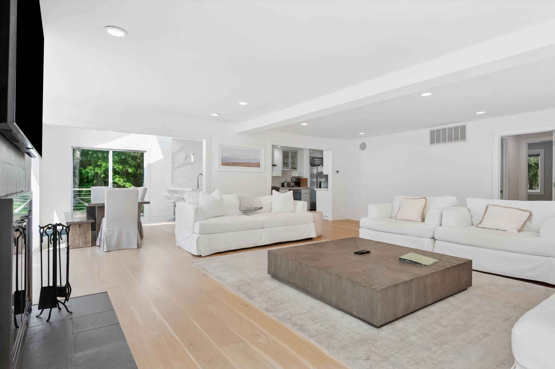 2 Jodys Path East Hampton, NY 11937 - Photo 16 of 43 a living room with furniture a flat screen tv and a table