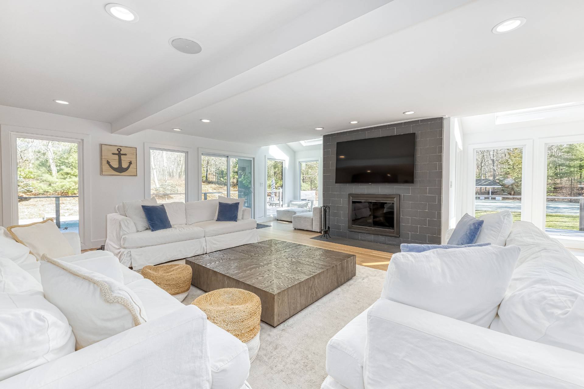 2 Jodys Path East Hampton, NY 11937 - Photo 17 of 43 a living room with furniture fireplace and a large window