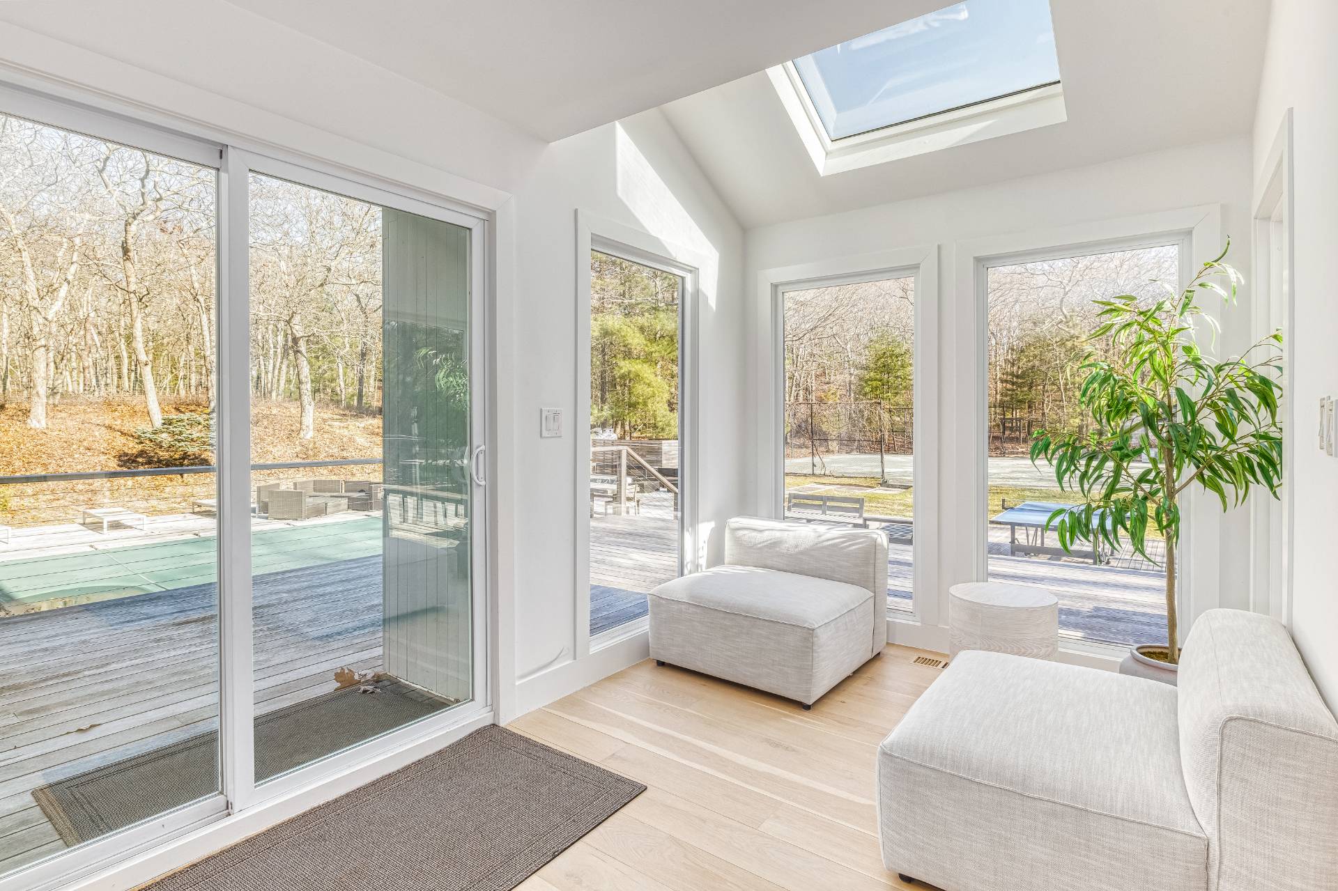 2 Jodys Path East Hampton, NY 11937 - Photo 20 of 43 a bedroom with furniture and large windows