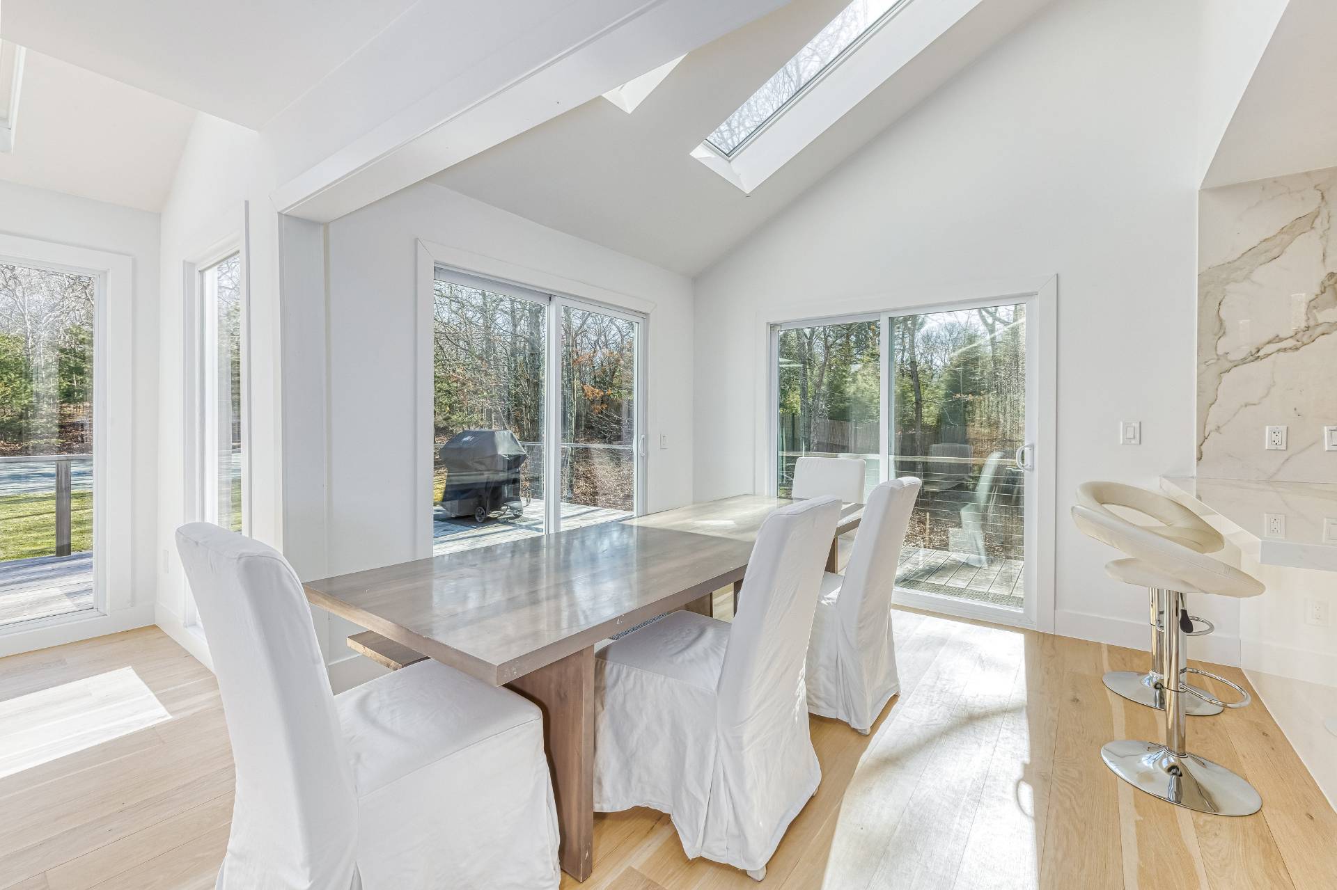 2 Jodys Path East Hampton, NY 11937 - Photo 21 of 43 a dining room with furniture window wooden floor