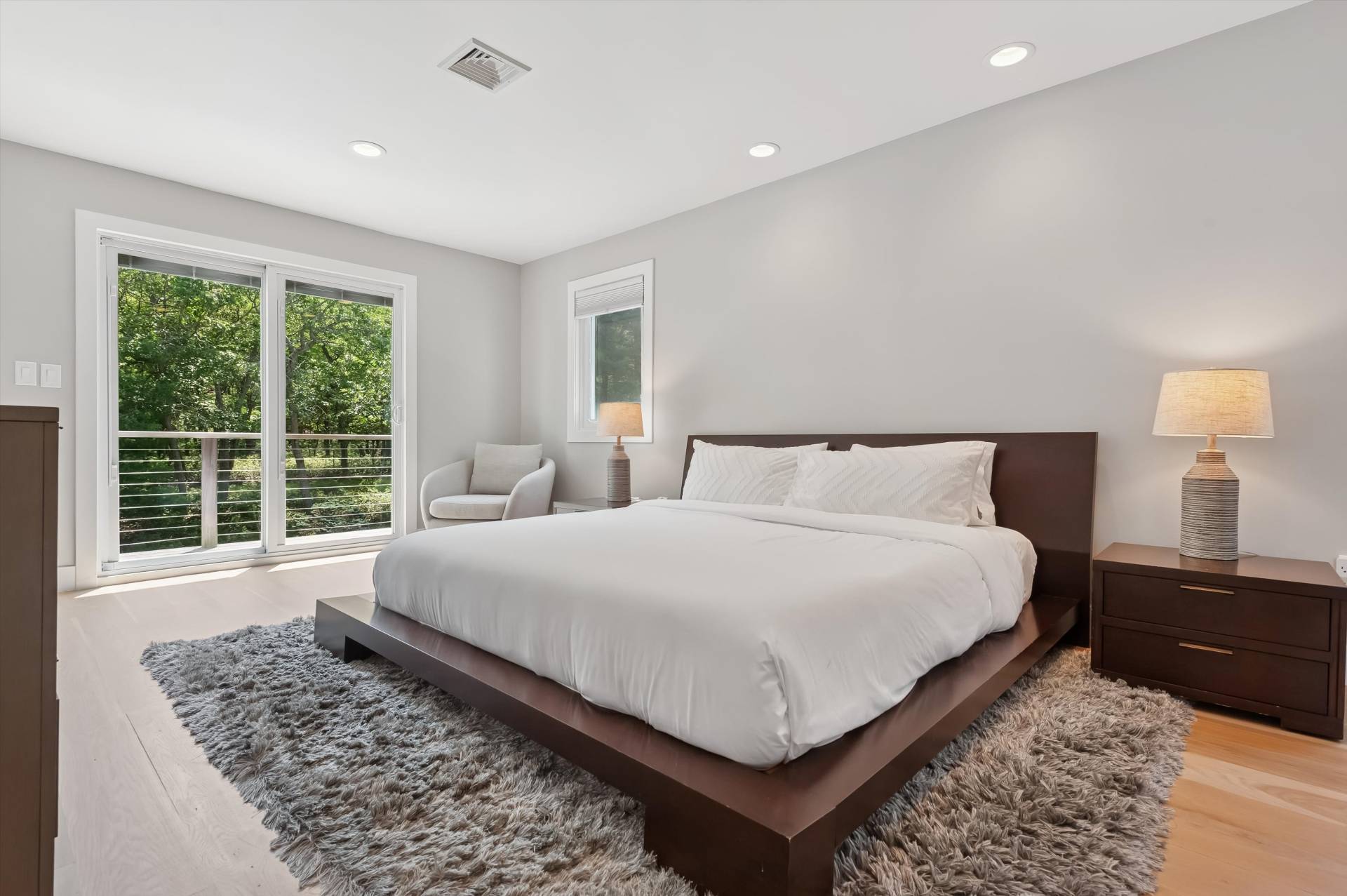 2 Jodys Path East Hampton, NY 11937 - Photo 29 of 43 a bedroom with a bed and wooden floor