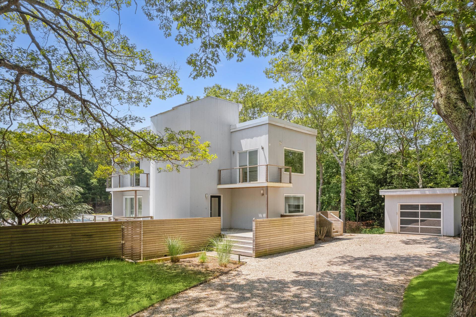 2 Jodys Path East Hampton, NY 11937 - Photo 3 of 43 a front view of a house with a garden and yard