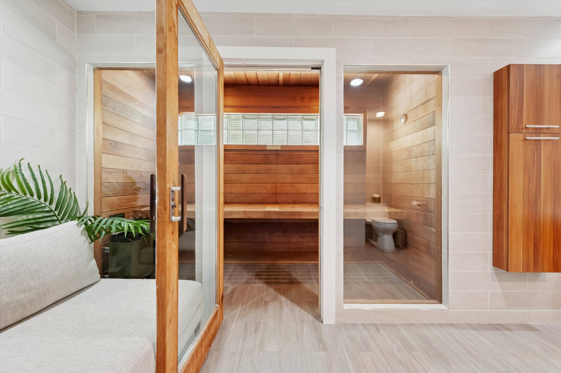 2 Jodys Path East Hampton, NY 11937 - Photo 33 of 43 a bathroom with a glass shower door and a toilet