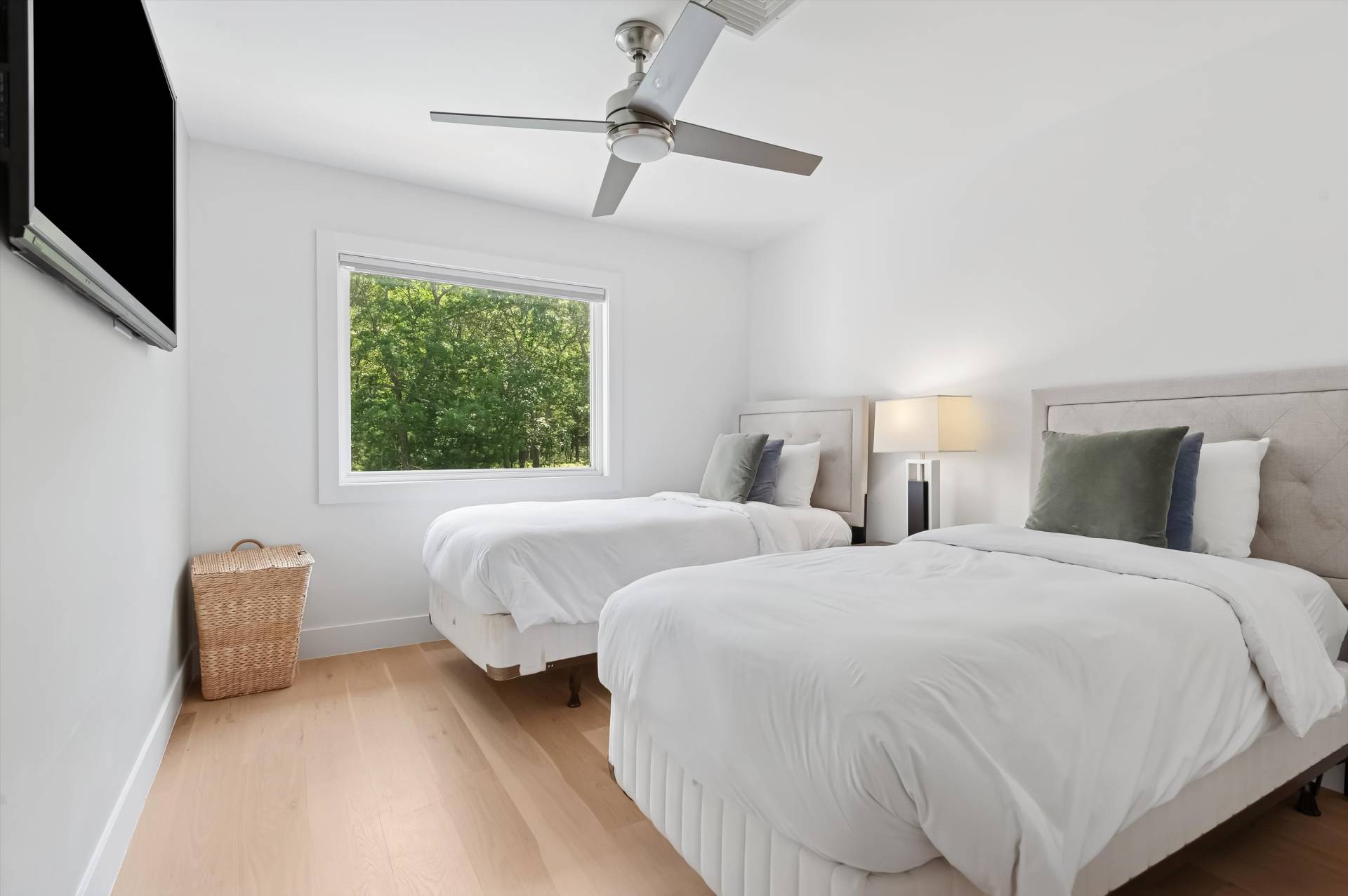 2 Jodys Path East Hampton, NY 11937 - Photo 34 of 43 a bedroom with two beds and a flat screen tv