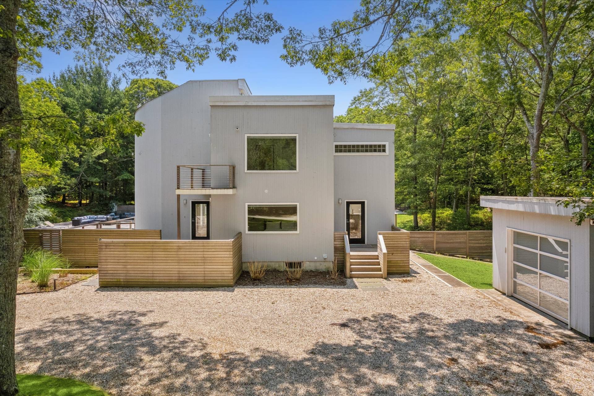 2 Jodys Path East Hampton, NY 11937 - Photo 4 of 43 a front view of a house with a yard